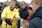 Ocean Environments instructor George Buckley and students take a close look at a horseshoe crab during a field trip to Cape Cod.